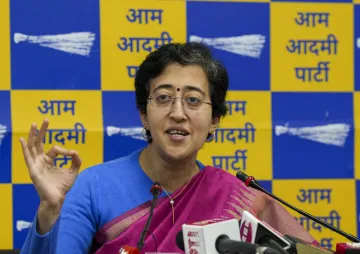 Delhi Minister Atishi addresses a press conference on ED raids, in New Delhi.