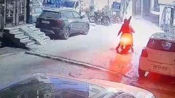 Two men fire multiple rounds outside a house in Yamuna Vihar in Delhi.