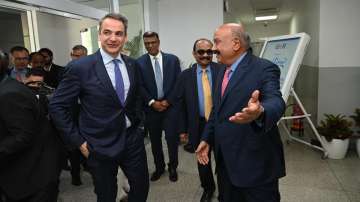 Greece Prime Minister Kyriakos Mitsotakis with GMR Group Chairman GM Rao at Delhi Airport.
