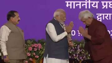 PM Modi being felicitated by J-K Governor General Manoj Sinha. 