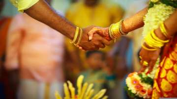 Uttar Pradesh news, Bride groom booked for celebratory firing in up, couple booked for celebratory f