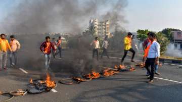 Maratha Kranti Morcha activists burned tyres and other inflamable items during a protest on the Pune-Solapur Highway to press for the Maratha reservation in Solapur.