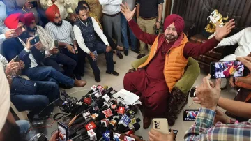 Congress leader Navjot Singh Sidhu addresses a press conference at his residence, in Patiala.