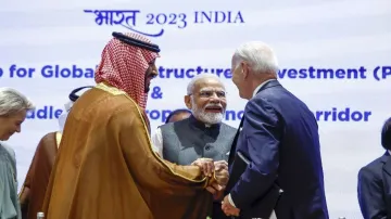 Saudi Arabian Crown Prince Mohammed bin Salman Al Saud, left, and US President Joe Biden, right, shake hands next to Prime Minister Narendra Modi on the day of the G20 summit in New Delhi