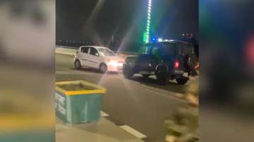 Cops chase man driving car in reverse on busy Ghaziabad elevated road.