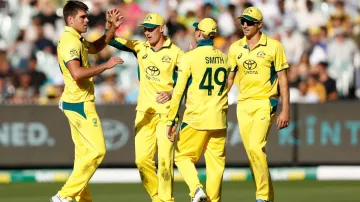 Xavier Bartlett celebrating a wicket with his teammates.