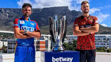 Keshav Maharaj and Aiden Markram pose with the SA20 2024 silverware.