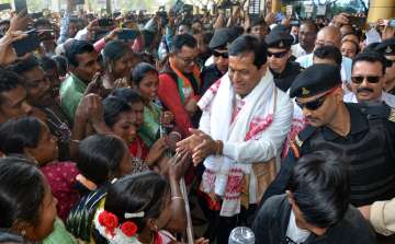 BJP leader Sarbananda Sonowal surrounded by his supporters