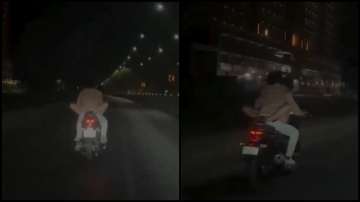 Ahmedabad Police, couple romancing on bike, man detained