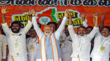 Prime Minister Narendra Modi with Tamil Nadu BJP President K Annamalai and Union Minister of State L Murugan in Tirupur, Tamil Nadu.