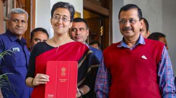 Delhi Finance Minister Atishi Singh with Chief Minister Arvind Kejriwal