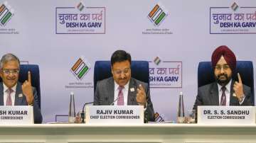 Chief Election Commissioner Rajiv Kumar flanked by Election Commissioners Gyanesh Kumar (L) and SS Sandhu during a press conference to announce the schedule for General Elections 2024, in New Delhi.