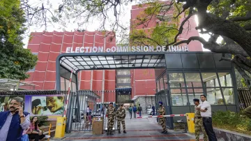 Security personnel stand guard outside the Election Commission of India (ECI) office, at Nirvachan Sadan in New Delhi.