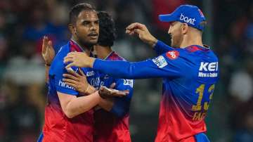 Yash Dayal celebrates a wicket with RCB teammates.