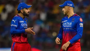 Virat Kohli having a conversation with Faf du Plessis.