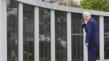 Biden looking at his uncle's name on the wall