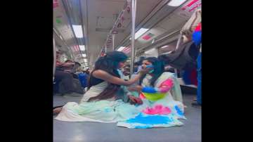 delhi mtero hoi reel, Delhi Police arrests two women for making obscene reel, women playing Holi in 