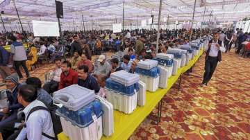 Polling officials collect EVMs and other election material at a distribution centre. (File photo)