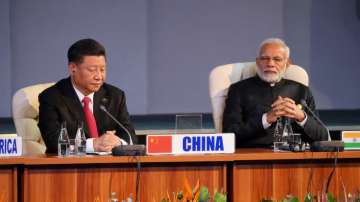 Prime Minister Narendra Modi and China's President Xi Jinping attend a BRICS summit meeting in Johan