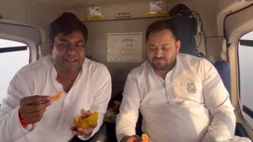 RJD leader Tejashwi Yadav accompanied by former minister Mukesh Sahni in the helicopter during election campaign.