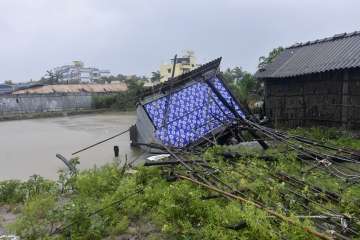 A house damaged by the cyclone Remal