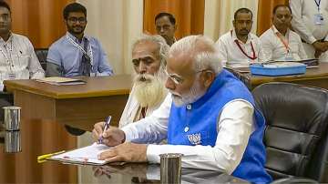 PM Modi with Pandit Ganeshwar Shastri while filing his nomination papers for Lok Sabha elections