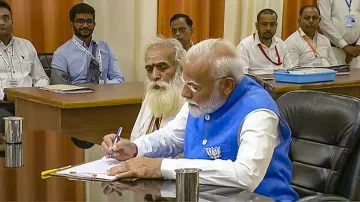 PM Modi with Pandit Ganeshwar Shastri while filing his nomination papers for Lok Sabha elections