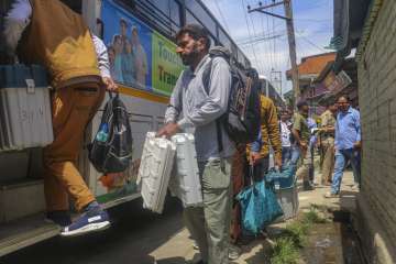 Polling officials return from polling booths