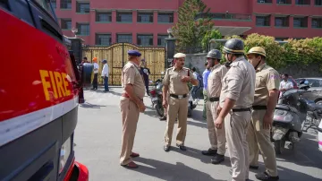 Police and fire department personnel outside Mother Mary’s School at Mayur Vihar, in New Delhi.