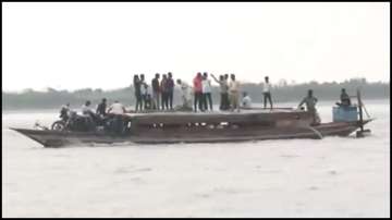 Voters in Assam's Dhubri Ghat use boats to reach polling booth