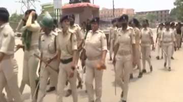 Chapra Police flag march after one killed in a scuffle between BJP and RJD workers