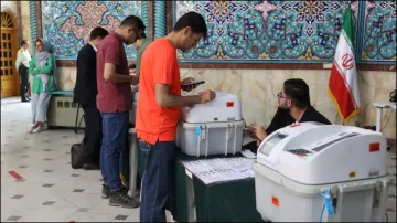 Iranians voting in the runoff parliamentary elections in early May.