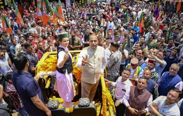 Former Himachal Pradesh CM Jairam Thakur with BJP candidate Kangana Ranaut during a rally for Lok Sabha elections, at Thunag in Mandi district.