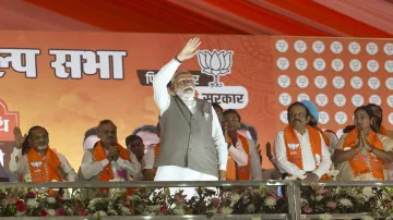 Prime Minister and senior BJP leader Narendra Modi during a rally for Lok Sabha elections, at Kartar Nagar in New Delhi.