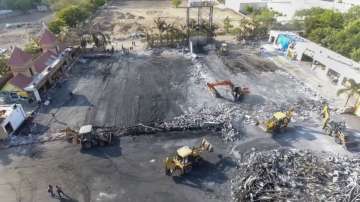 Debris being removed from the game zone site where a fire broke out on Saturday, in Rajkot. (File photo)