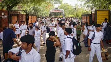 
Students come out of a School after a bomb threat was received on May 1.