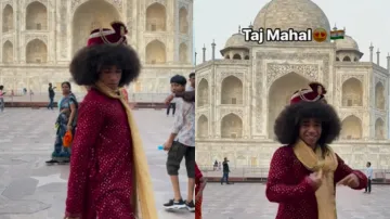 Influencer dancing outside the Taj Mahal