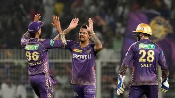 Sunil Narine celebrates a wicket with his KKR teammates.