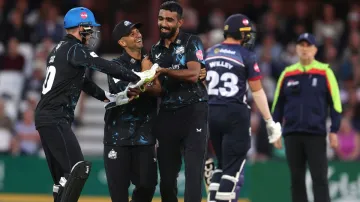 Usama Mir celebrates a wicket with his Worcestershire Rapids teammates.