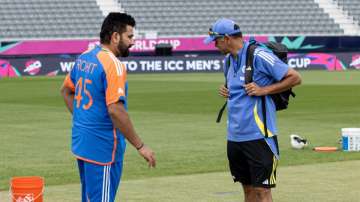 Indian skipper Rohit Sharma and head coach Rahul Dravid examining the Nassau County Stadium pitch in New York