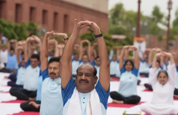 Om Birla performs Yoga