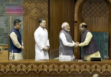 PM Modi, LoP Rahul Gandhi and Parliamentary Affairs Minister Kiren Rijiju accompany Birla to the Chair