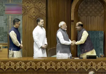 PM Modi, LoP Rahul Gandhi and Parliamentary Affairs Minister Kiren Rijiju accompany Birla to the Chair