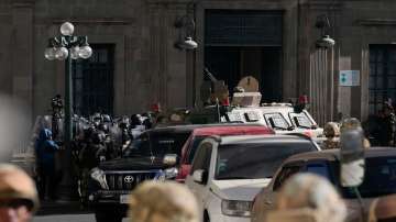 Army vehicle smashes through doors of Bolivian presidential palace