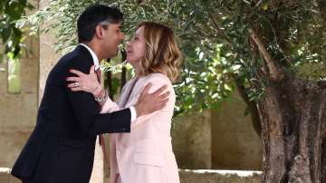 British Prime Minister Rishi Sunak is welcomed by Italy's Prime Minister Giorgia Meloni on the first