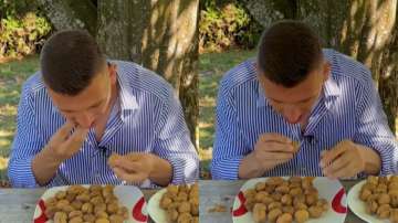 German man crushing 44 walnuts