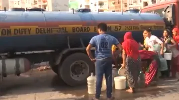 People in the Chilla Gaon of Mayur Vihar area fulfil their water requirements by calling in water tankers amid water crisis in the national capital.