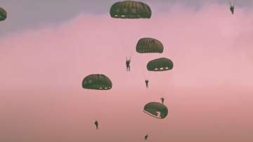 Parachutists jumped from World War II-era planes into now peaceful Normandy to kick off a week of ce