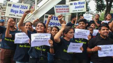 Students raise slogans during protest over alleged irregularities in NEET 2024 results