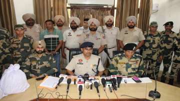 Punjab Police, BSF arrest two suspected smugglers, Punjab Police recover over Rs 1 crore in Amritsar